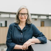 Image of Kerry Swain, SMI Learning and Teaching Manager stood in the Wave Atrium