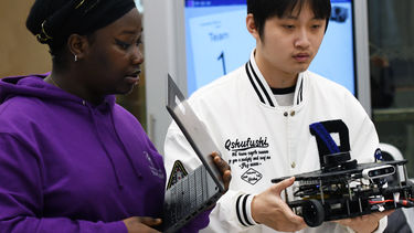 Two students studying computing and robotics 2