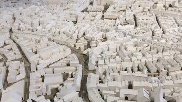 A minuature model of a city with a large number of buildings and roads
